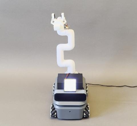 Context Is Cue-Cial: Assessing the Interpretation of Social Signals from Non-anthropomorphic Robots in Different Contexts