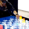 CheckMate: Exploring a Tangible Augmented Reality Interface for Remote Interaction