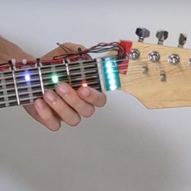 Let's Frets! Assisting Guitar Students During Practice via Capacitive Sensing