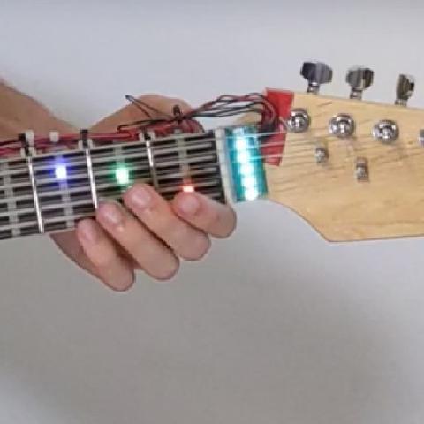 Let's Frets! Assisting Guitar Students During Practice via Capacitive Sensing
